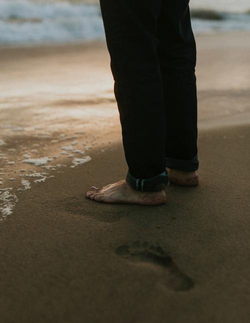 Man standing by the seaside - 1079876