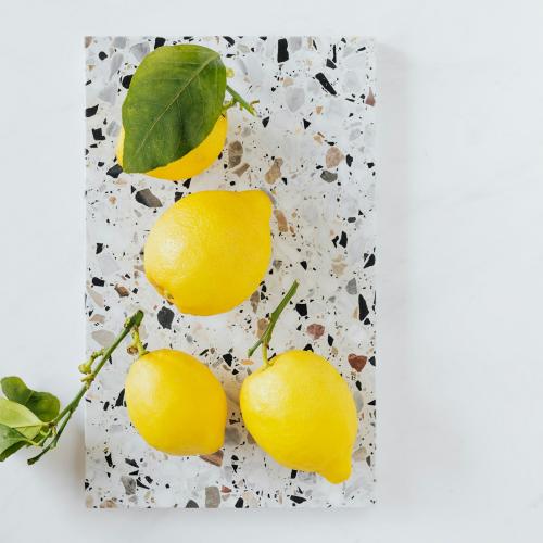 Fresh and organic lemons on a marble chopping board flatlay - 1198199