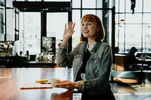 Woman having a cup of coffee in a cafe - 1198600