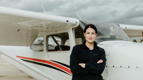 Aviator standing by the front propeller plane - 1202197