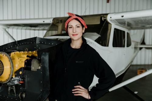 Aviator standing by the front propeller plane - 1202201