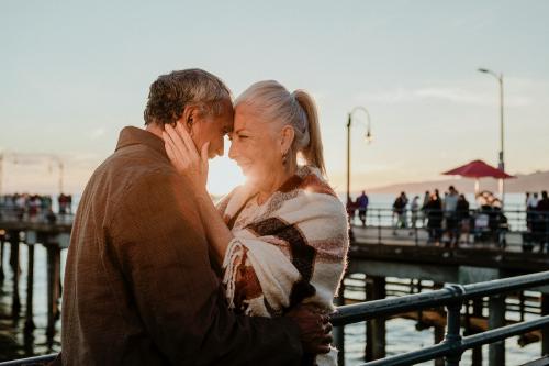 Romantic senior couple by the pier - 1202679