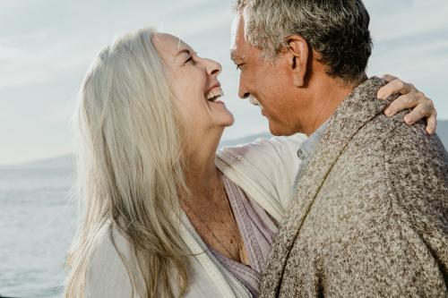 Cheerful senior couple dancing on Santa Monica Pier - 1202722