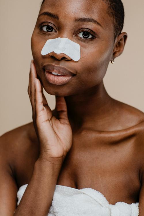 Black woman with a nose pore strip - 1203325