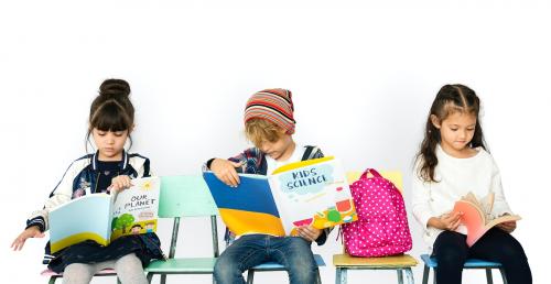 Group of Students Reading Book Sitting on the Chair - 7099