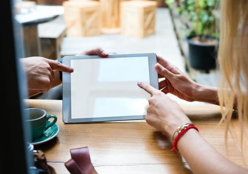 Couple using digital tablet in a cafe - 6368