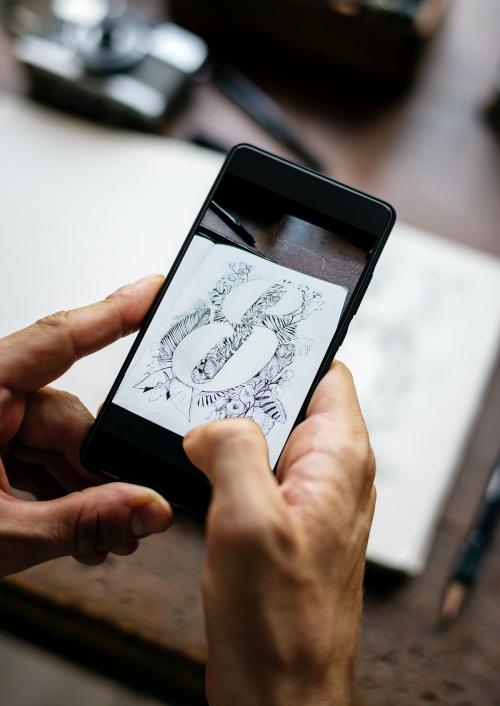 Closeup of mobile phone screen showing snap drawing art - 5936