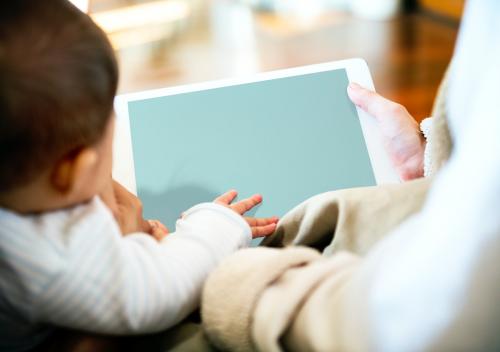 Parents are using digital device sharing to their children. - 6087