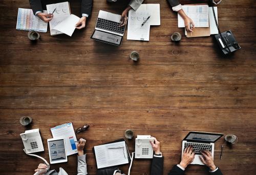 Business people working together on a wooden table - 6220