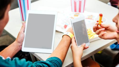 Junk food and a digital devices with empty screen - 5318