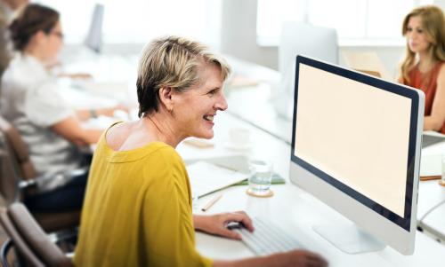 Cheerful woman using the computer - 5380