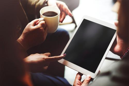 People looking at an empty screened tablet - 5465