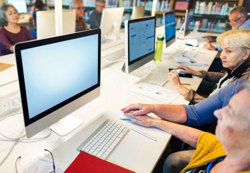 Senior woman using a computer with an empty screen - 5467