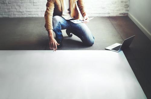 Man planning on a big sheet of empty paper - 5484