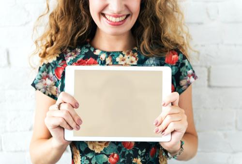 Caucasian woman holding digital tablet - 5485