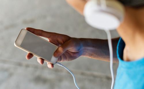 Man listening to music through a smartphone with copyspace - 5558