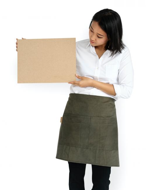 Woman wearing an apron holding an empty placard - 5669