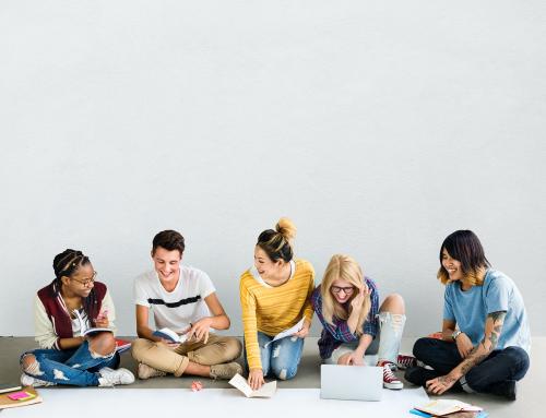 Group of diverse teens doing their project on the floor - 5702