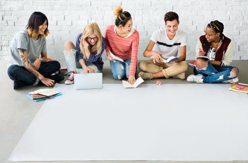 Young group studying on the floor together - 5843