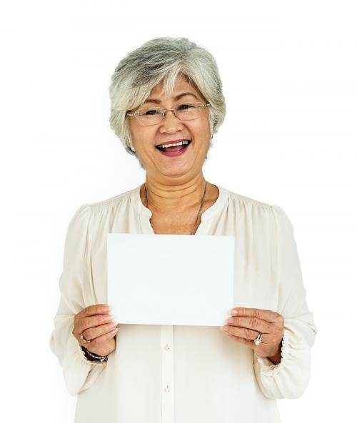 Senior lady holding a blank placard - 5876