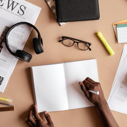 Black man writing on a notebook mockup - 1213825