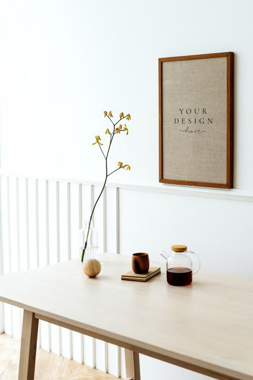 Wooden photo frame mockup hanging on a white wall - 1215255