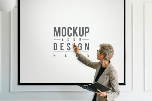 Blonde aged woman having a presentation mockup - 1216651