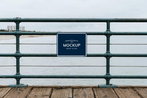 Premium quality board mockup on a fence by the beach - 1221409