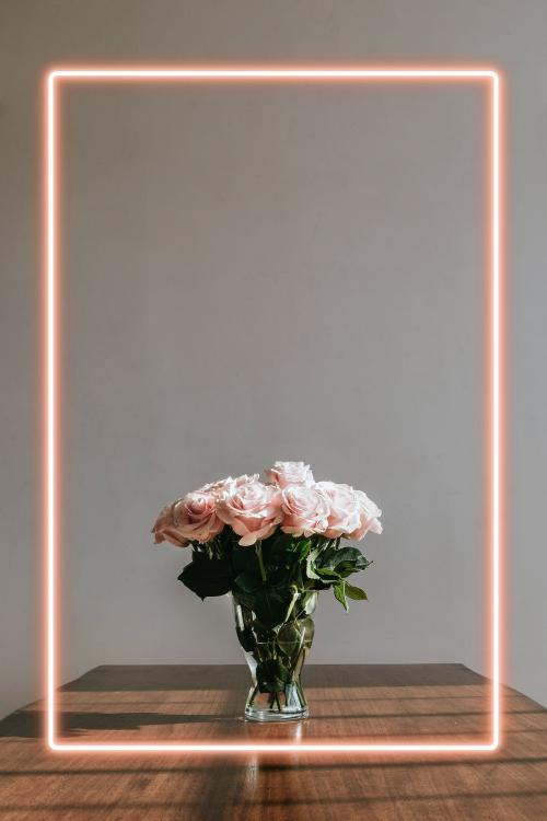 Beautiful pink roses in a vase on a table - 1221572