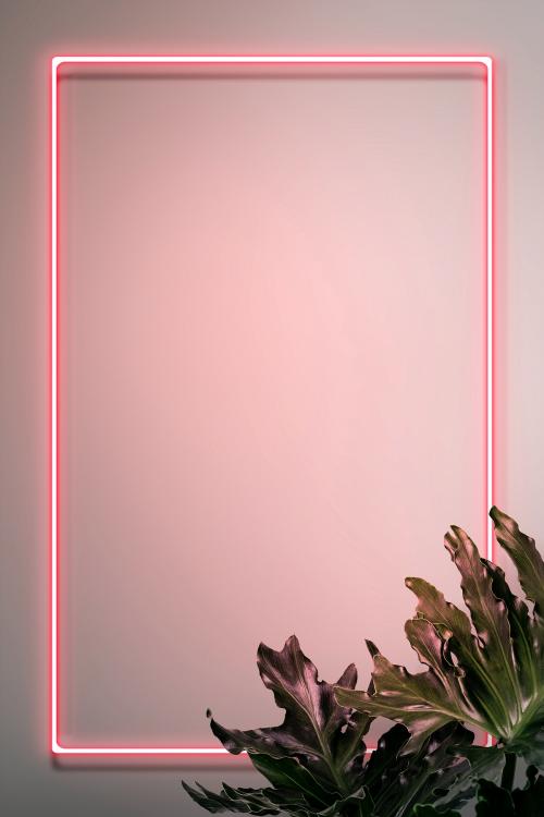 Pink neon frame on a wall with tropical plants mockup design - 1223339