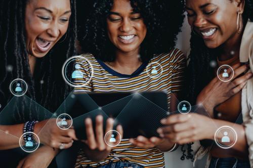 Girls watching an online video clip on a digital tablet mockup - 1223934