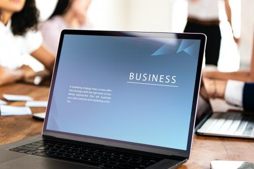 Laptop on the table in a meeting mockup - 1225000