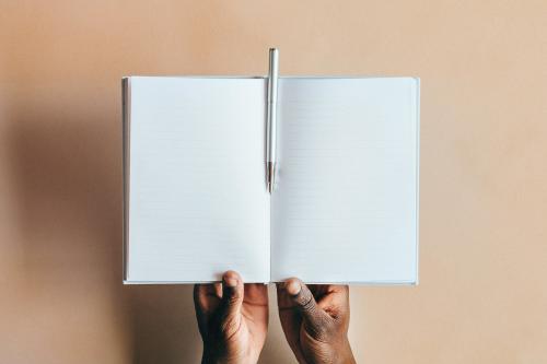 Woman writing in a notebook - 1226342