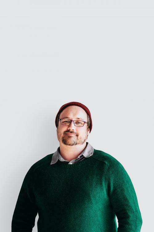 Portrait of a man with beard in green sweater - 1228174