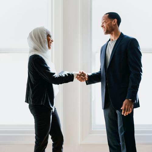 Happy diverse business people shaking hands at the office - 1208640