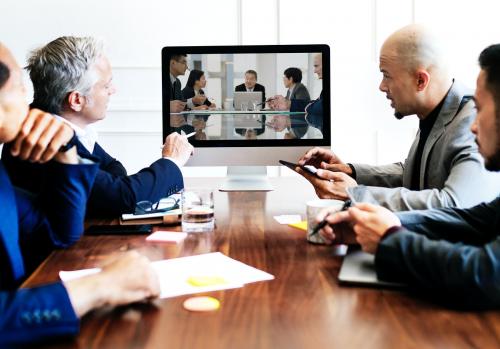 Business people having a conference meeting using a computer screen mockup - 1208705