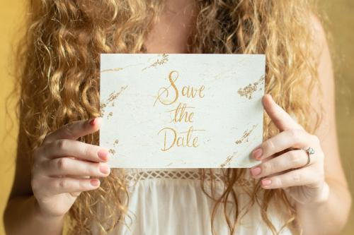 Blond woman with an invitation card mockup - 1209194