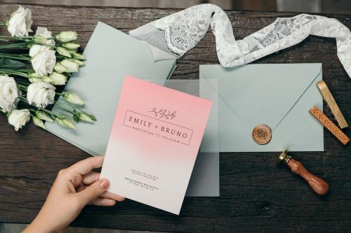 Woman with a wedding invitation card mockup - 1209204