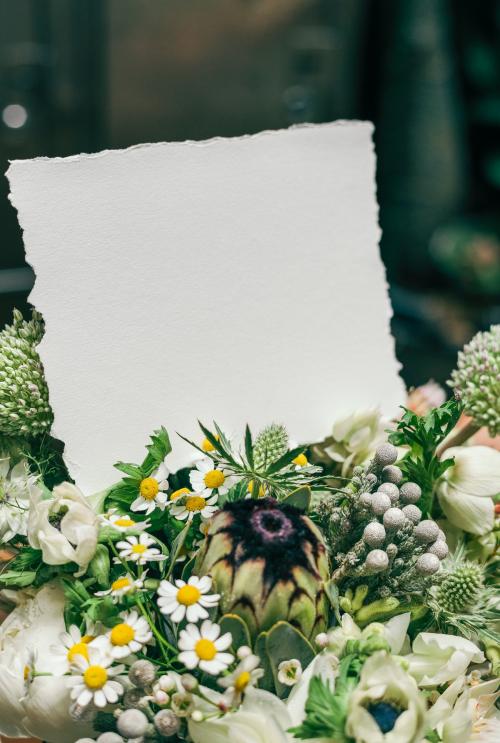 Bouquet of white flowers with a blank card - 1209299