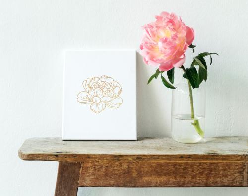 Pink peony in a vase by the wall with a card mockup - 1209930