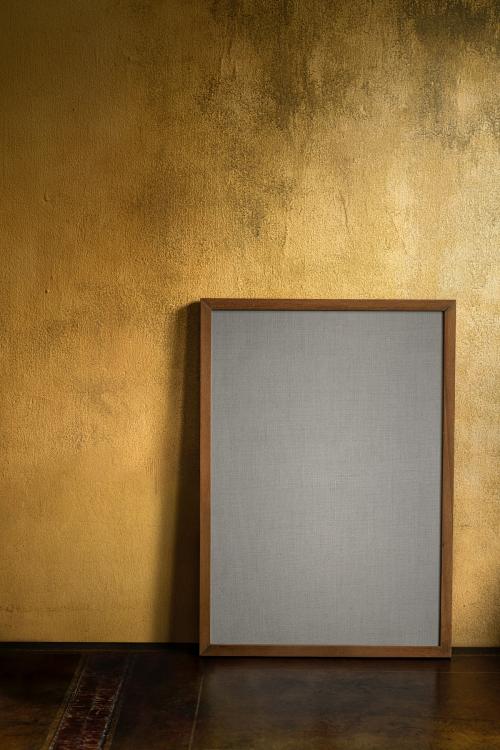 Blank wooden frame mockup by a grunge yellow wall - 1212414