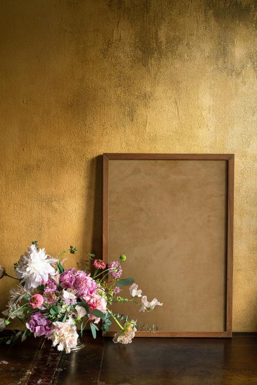 Wooden frame mockup by the flowers - 1212454