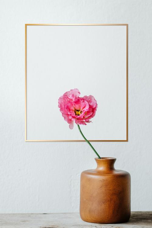 Golden frame on a white wall - 1212872