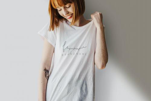 Smiling woman wearing a silk screenwhite t-shirt mockup - 1198702