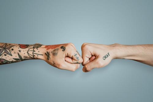 Friends giving each other a fist bump mockup - 2206474