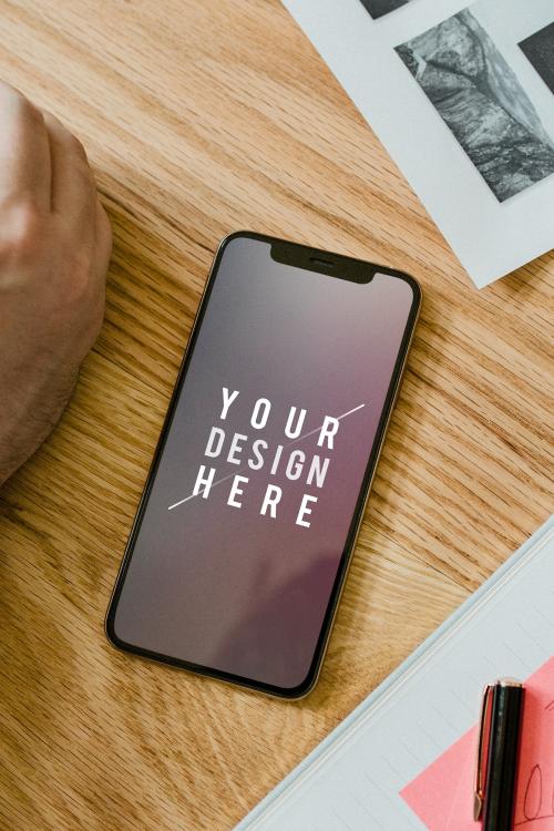 Blank mobile phone mockup on a wooden table - 2012934