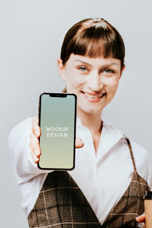 Happy woman displaying a mobile phone mockup - 2020172