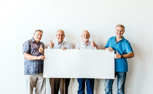 Elderly men holding a blank poster mockup - 2027101