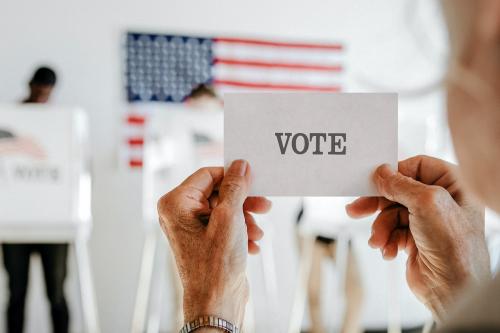 Elderly woman showing ballot up in the air mockup - 2030028