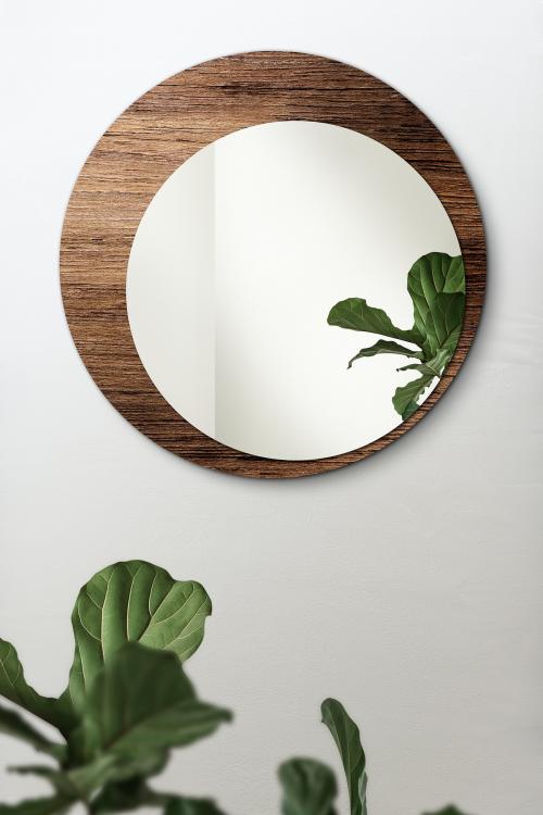 Circular mirror with a wooden backdrop mirroring fiddle-leaf fig mockup - 2036836